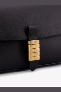 Pinko women’s black leather saddle flat crossbody bag with a black leather clutch and gold-tone pinko clasp