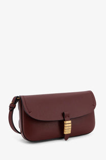 Pinko women’s saddle flat leather crossbody bag in burgundy with gold-tone lock closure and matching strap