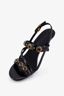 Pinko women’s Vanda black leather sandal with gold coin embellishments and slender ankle strap