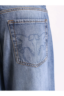 Back side of pinko women’s wanda wide leg light-wash denim jeans with subtle embroidered eagle on the pocket