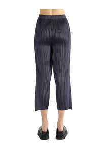 Dark blue pleated capri pants with sleek modern design from pleats please issey miyake womens pants monlty colors black