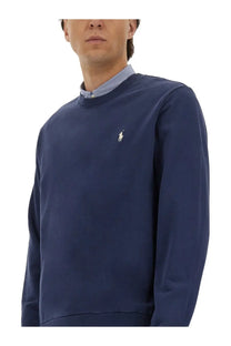 Navy blue Polo Ralph Lauren men’s cotton jersey sweatshirt with small white embroidered polo player logo on chest