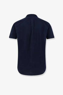Back view of navy blue cotton polo ralph lauren men’s short-sleeved button-down shirt with central seam and collar