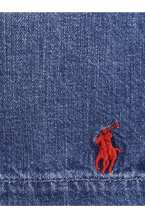Red embroidered polo player logo on blue denim fabric of polo ralph lauren men’s denim bermuda shorts blane