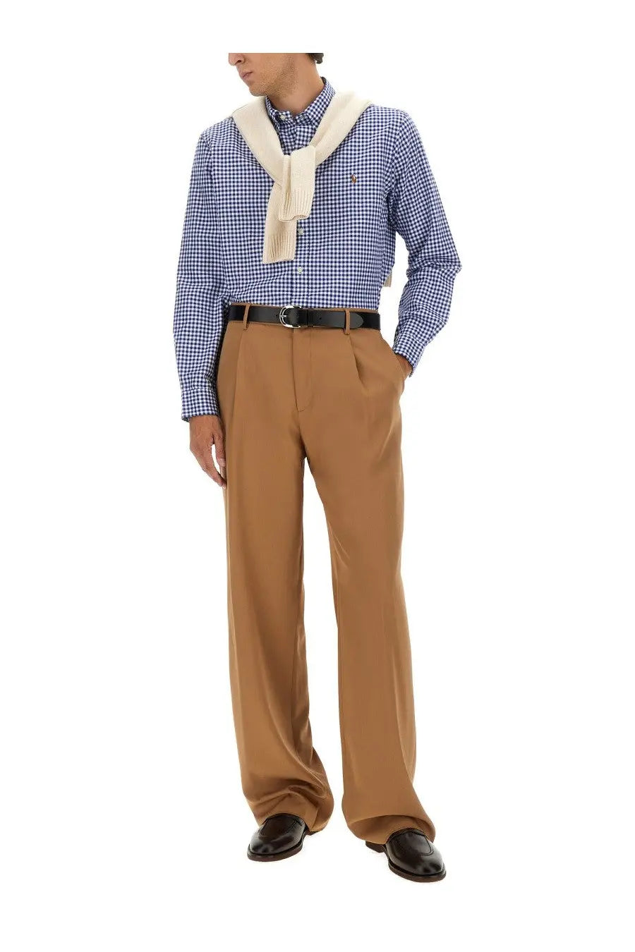 Tan pleated wool trousers with black belt and polished leather shoes styled with polo ralph lauren men’s blue oxford shirt
