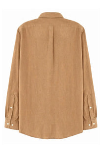 A tan Polo Ralph Lauren men’s long-sleeved button-down shirt with subtle textured fabric and classic collar