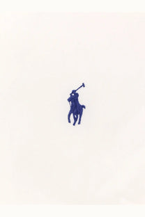 Blue embroidered polo player logo on white stretch cotton fabric of polo ralph lauren men’s shirt front side