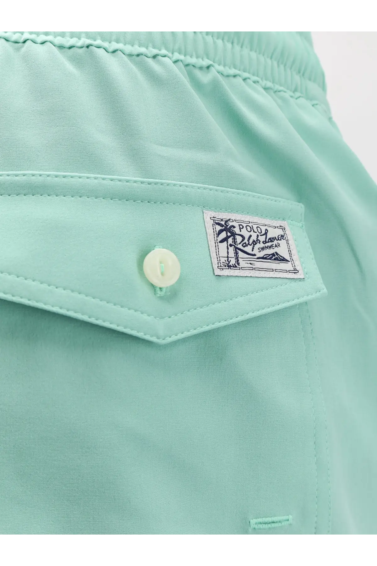 Mint green cotton Polo Ralph Lauren men’s swim trunks with a buttoned flap pocket and embroidered brand patch