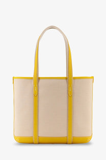 A vibrant yellow and beige Polo Ralph Lauren women’s canvas shoulder bag with leather trim and sturdy handles