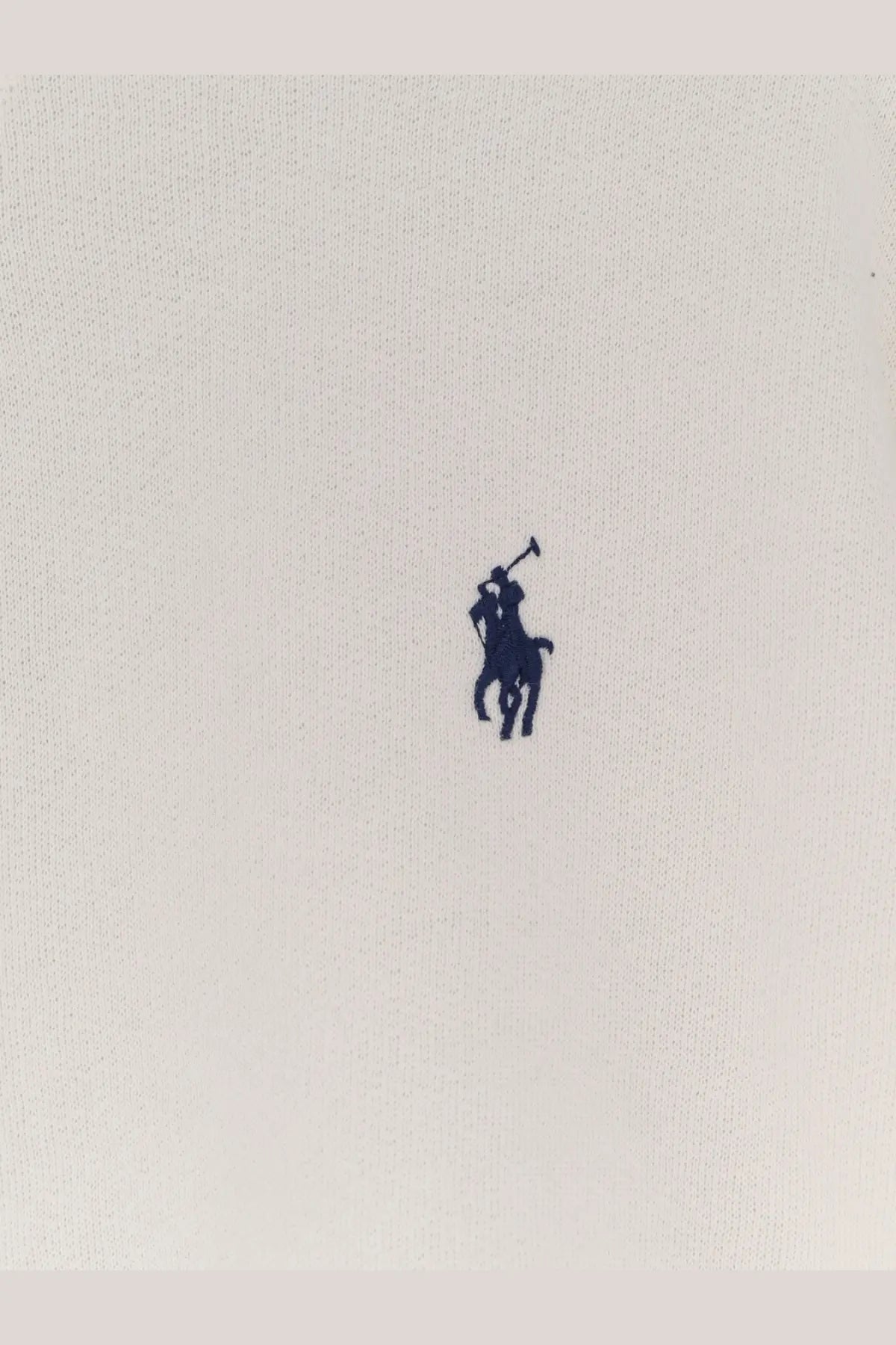 Navy blue embroidered polo player logo on light beige cotton fabric of polo ralph lauren women’s cotton blend sweater white