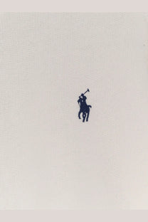Navy blue embroidered polo player logo on light beige cotton fabric of polo ralph lauren women’s cotton blend sweater white