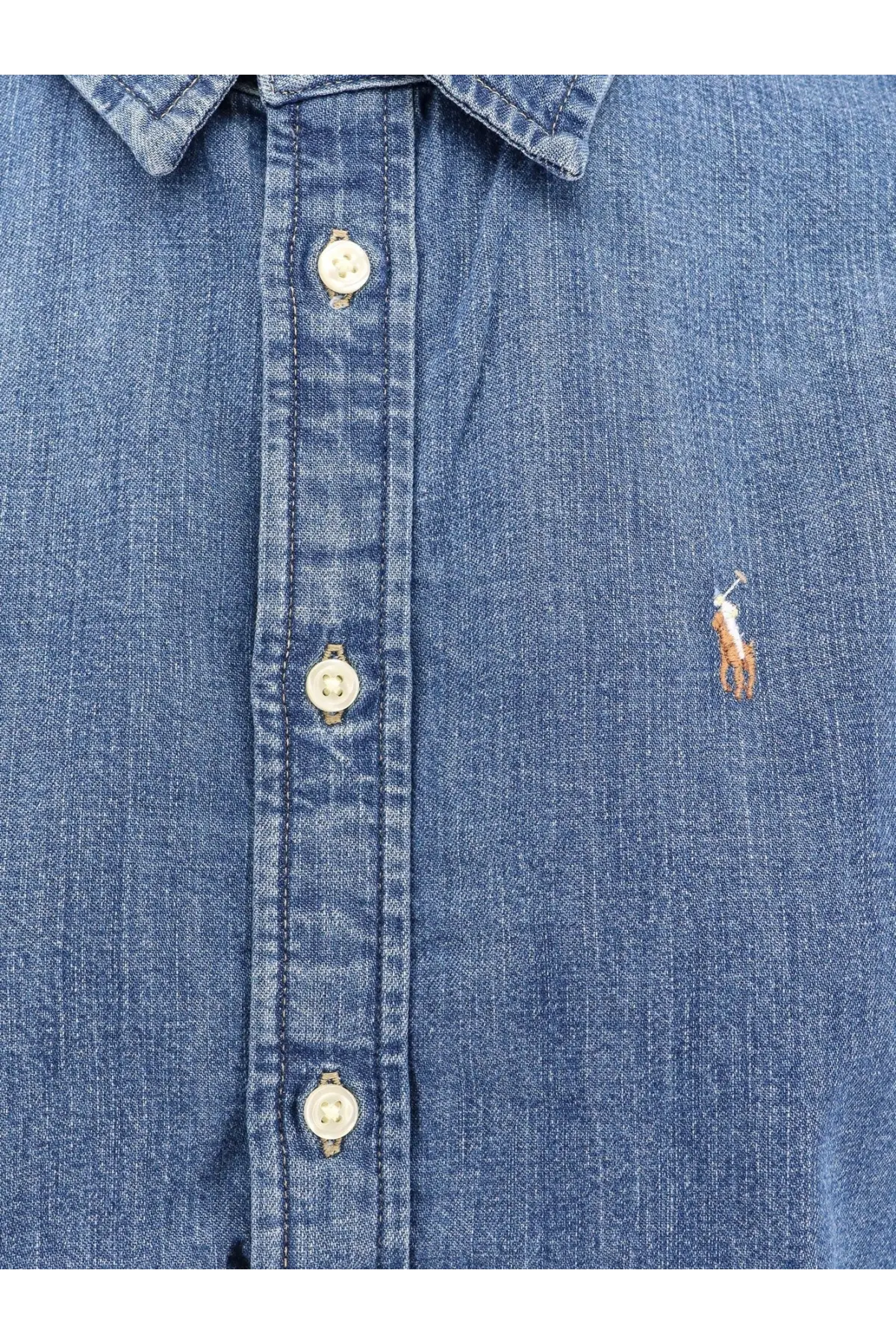 Blue denim button-up shirt with embroidered polo player logo on chest from polo ralph lauren womens mercedwash collection