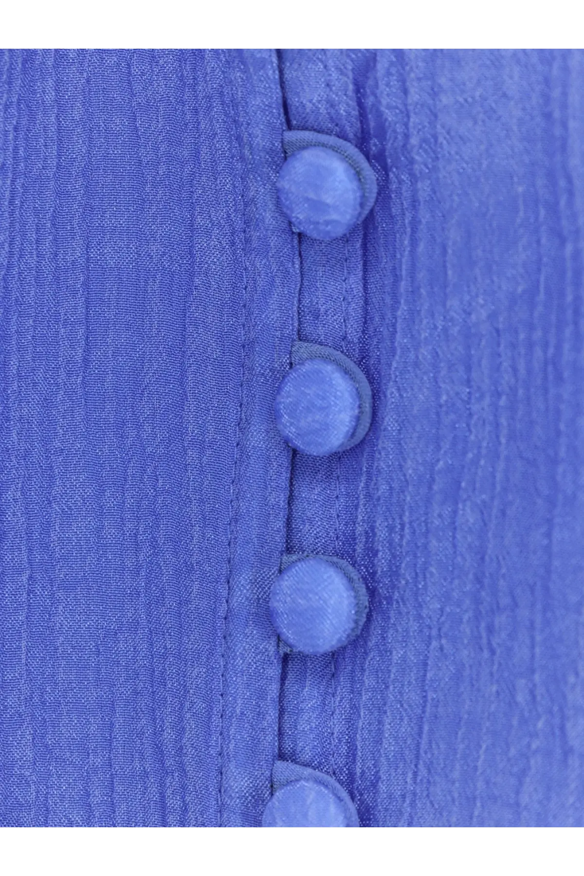 A polo ralph lauren women’s lyocell shirt in blue with textured pleats and matching light blue fabric buttons along the front