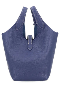 Deep blue textured leather tote bag with white stitching and minimalist flap closure by Polo Ralph Lauren Women