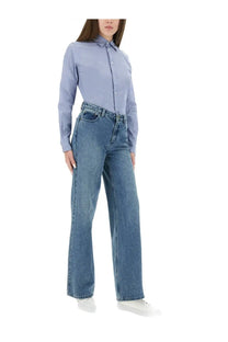 Polo Ralph Lauren women’s light blue long-sleeved button-up shirt with classic collar and pressed fabric