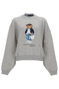 Polo Ralph Lauren women’s grey heathered sweatshirt with detailed embroidered polo bear paired with navy jacket and blue jeans