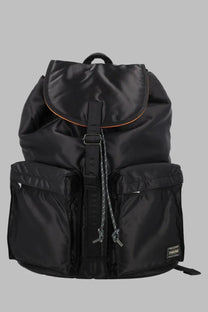 Porter-yoshida &amp; co men’s zaino tanker black nylon backpack with orange trim and small brand patch on lower right side