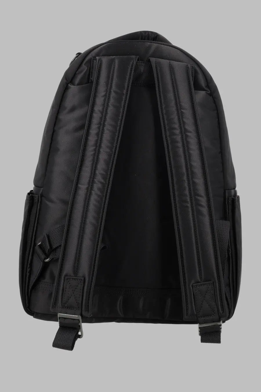 Porter-yoshida &amp; co men’s zaino tanker black nylon backpack with padded shoulder straps and side pockets shown from the back