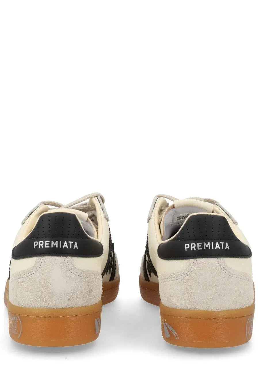 Cream-colored suede premata men’s sneaker bonnie white with black accents and gum rubber sole shown from the back