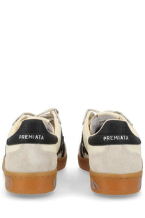 Cream-colored suede premata men’s sneaker bonnie white with black accents and gum rubber sole shown from the back