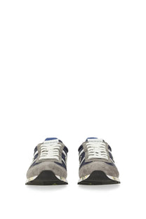 Premiata men’s sneaker Lucy Blue in gray suede and navy blue with white laces and a metallic silver sole