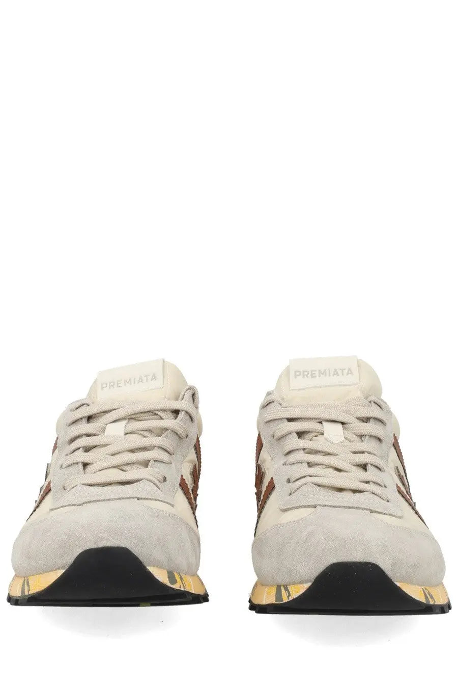 Premiata men’s sneaker lucy white cream suede with brown accents and black and gold sole featuring premiata brand name on tongue