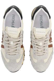 Premiata men’s sneaker Lucy white with cream and gray suede and brown leather accents featuring a retro design