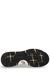 Black rubber sole with gold star-shaped tread and premiala logo patch on premiala men’s sneaker mase white