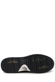 Black rubber sole with gold lettering and white triangular logo patch on back of premiata men’s sneaker mick blue