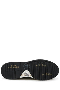 Black rubber sole with gold lettering and white triangular logo patch on the back of premiata men’s sneaker mick green