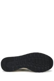 Black rubber sole with textured tread and adidas logo embossed near the heel of premiata men’s sneaker nous white