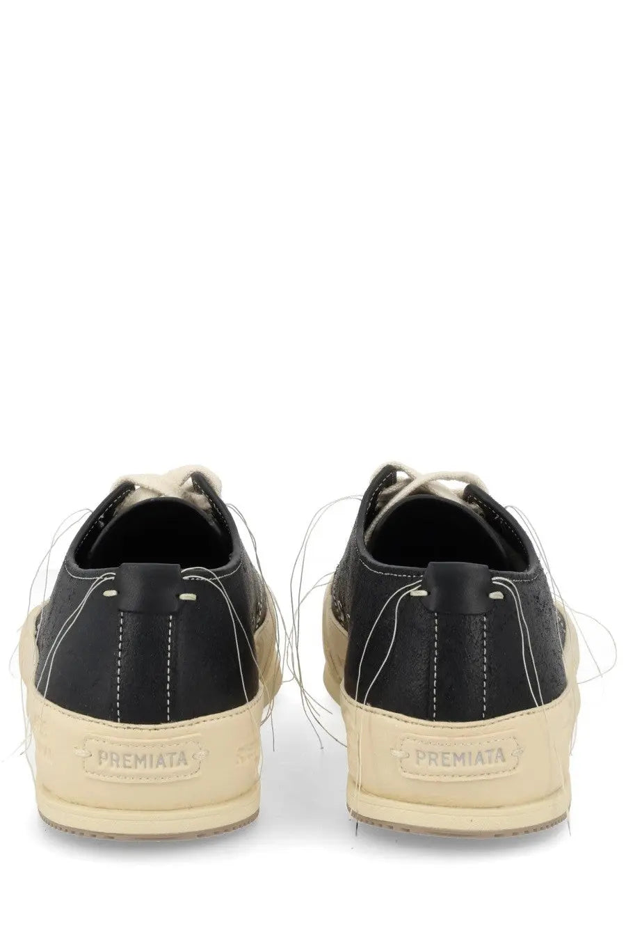 Premiata men’s sneaker Vincent black in leather with cream soles and white stitching visible from the back side