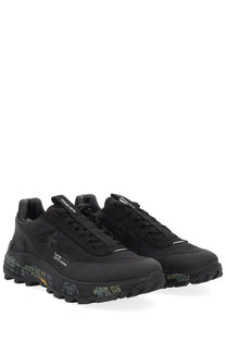 Premiata men’s snerker denvin black athletic sneakers with rugged textured soles and subtle graffiti-style branding in muted green and white