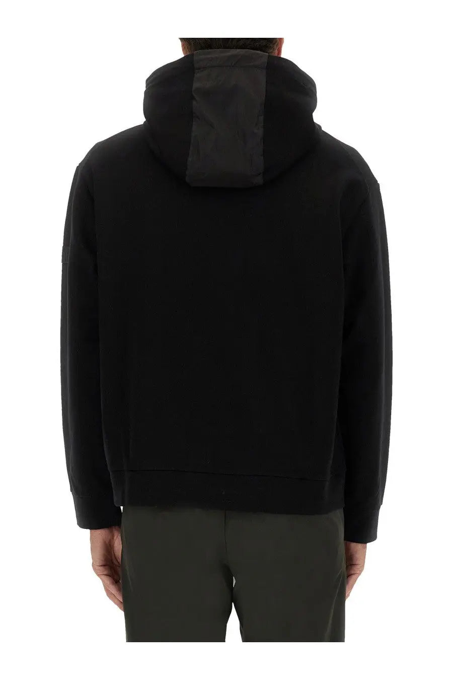 Back side of premiata men’s black hooded zip sweatshirt with contrasting dark gray panel on the center back
