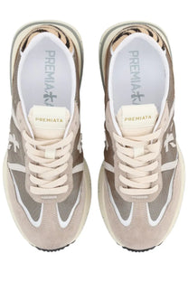 Premiata women’s Cassie sneaker in beige and gray with tiger-print heel lining white laces and contrasting white stripes