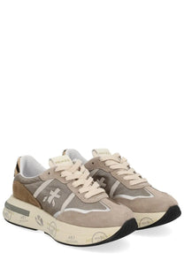 Premiata women’s cassie sneaker in beige and gray suede with white laces and chunky off-white sole with black accents