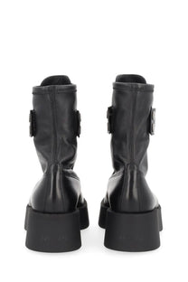 Premiata women’s black leather ankle boots with chunky soles and metallic buckle accents