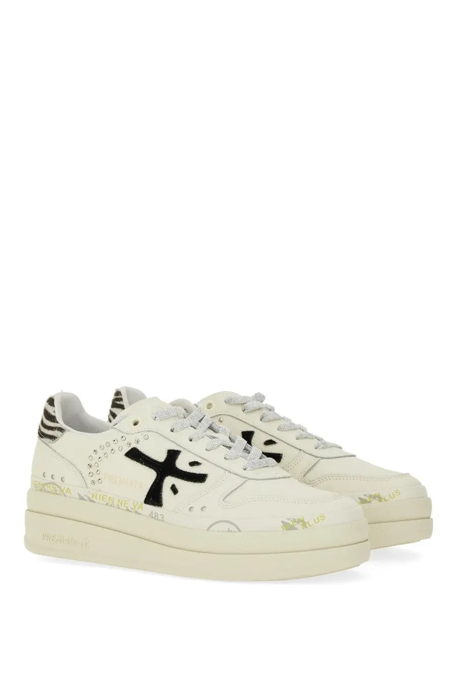 Cream-colored Premiata women’s Micol platform sneakers with black logo, zebra print accents, and gold foil sole detailing