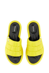 Bright yellow quilted nappa slide sandals with black soles and premiata brand label on the insole for women