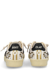 Premiata women’s sneaker bsktclad beige with cream color gold stripes black heel tabs and metallic decorative studs back view