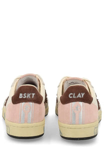 Premiata women’s low-top sneaker in pink and beige suede with brown heel tabs featuring bskt and clay branding