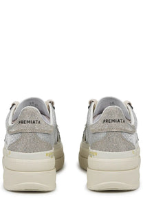 Back side of premiata women’s sneaker claudia grey silver textured with chunky off-white sole and premiata branding on heel