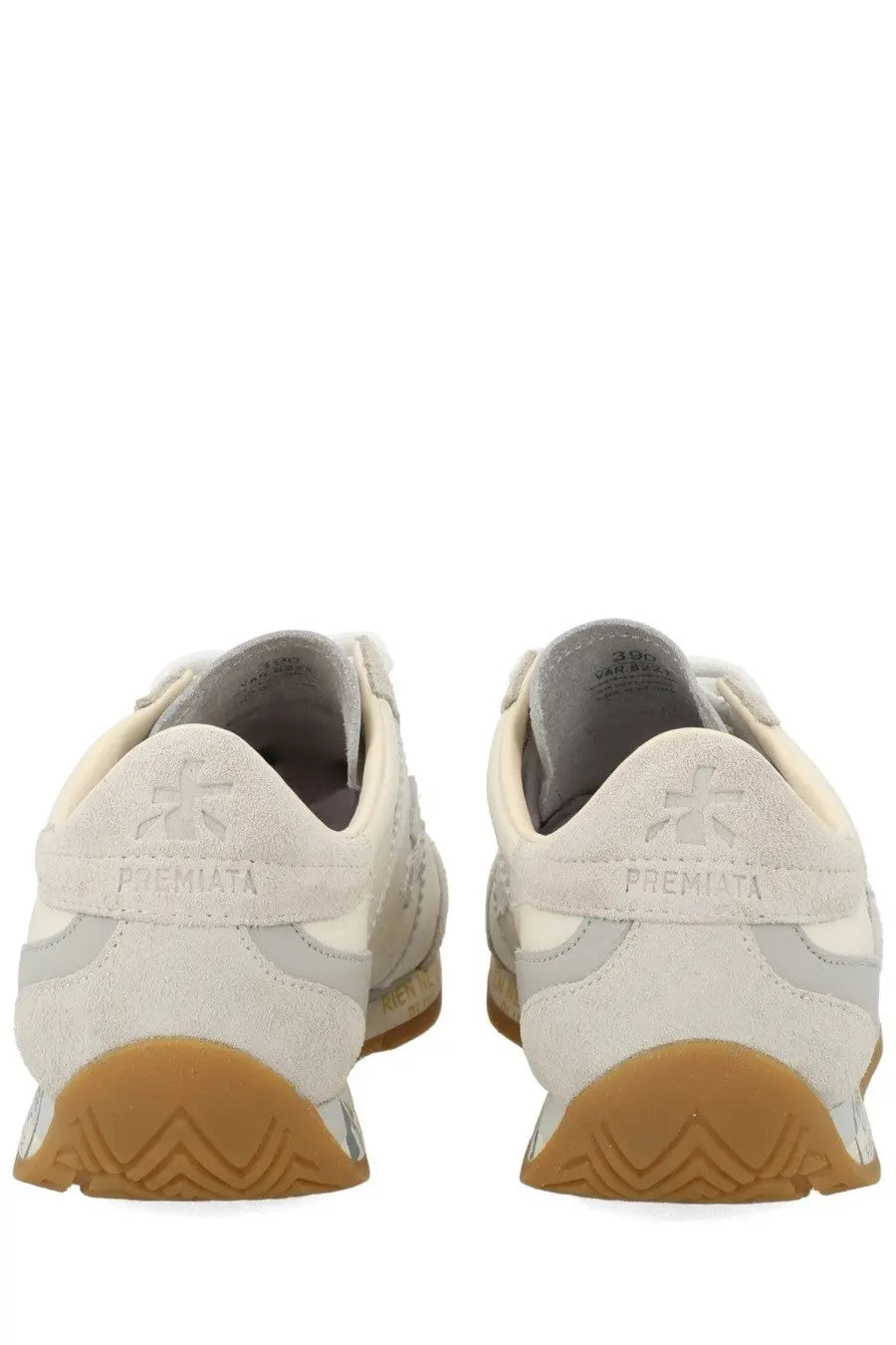 Back view of cream-colored premiata women’s sneaker jackyx 25d in suede and mesh with tan rubber sole and logo heel