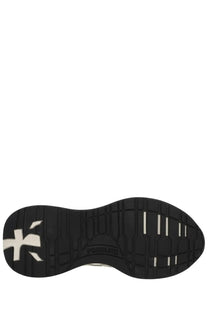 Black rubber sole with white logo and textured tread pattern on prematta women’s sneaker lauryn multicolor