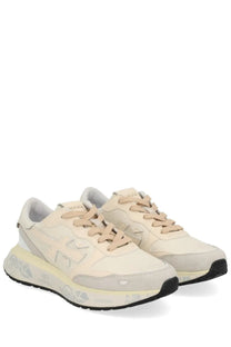 Cream-colored premiata women’s sneaker lauryn multicolor with suede and canvas materials and gray branding details