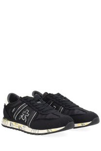 Premiata women’s sneaker lucy black with white branding and graffiti style pattern on the sole