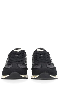 Premiata women’s sneaker Lucy black black and white athletic shoe with distressed layered design and reflective side stripes