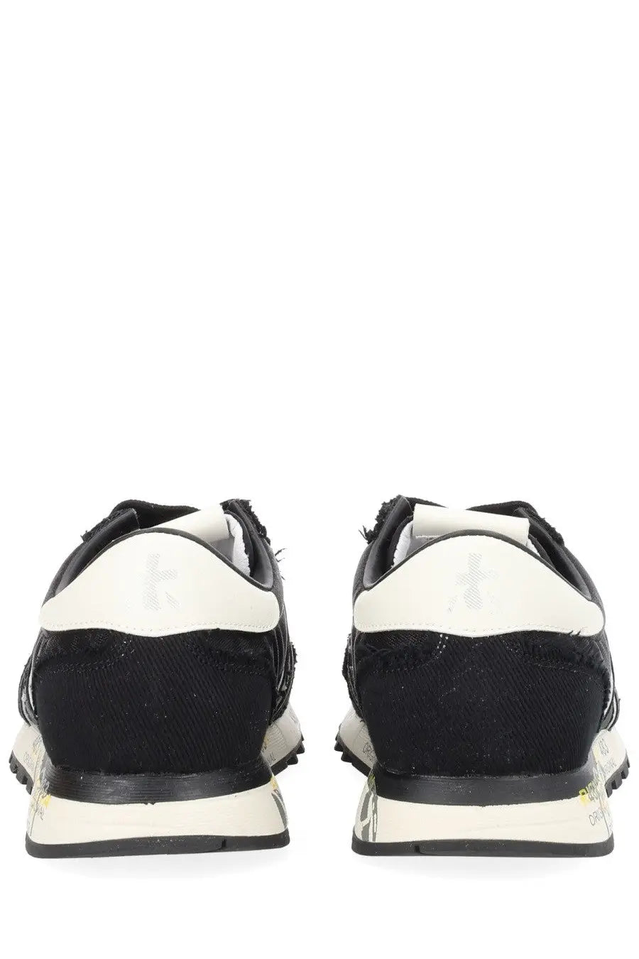 Premiata women’s sneaker lucy black showing back side with black and white distressed textured upper and subtle heel branding