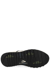 Black rubber sole with textured tread and embossed branding on premiata women sneaker lucy white back side