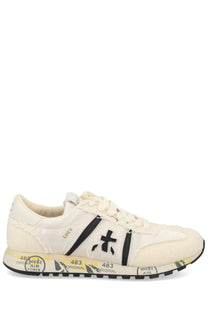 Premiata women’s sneaker lucy white cream canvas sneaker with black stripes and graphic branding along the sole